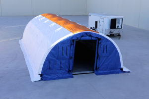Exterior of a 16' x 32.5' EXT Medical Trailer System and its secure 7' x 14' trailer.