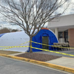 Photo of a BLU-MED medical shelter equipped with a negative pressure isolation system being set up at Lexington Medical Center, Columbia, South Carolina.